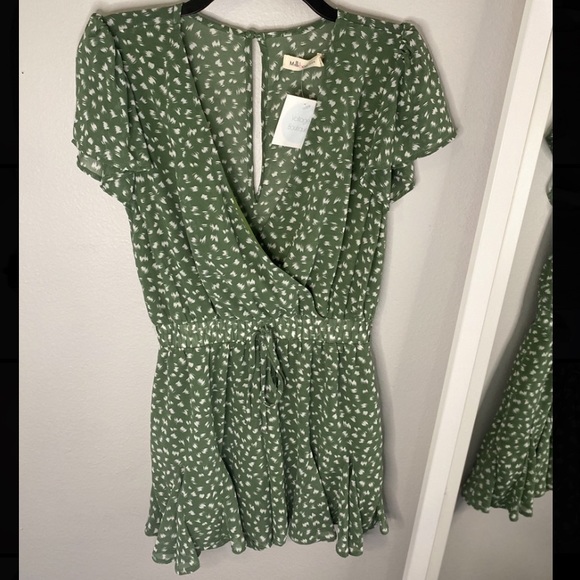 green and white polka dot jumpsuit